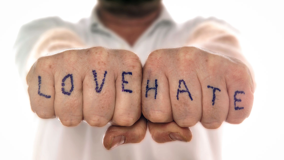 Man with love and hate tattooed on fingers