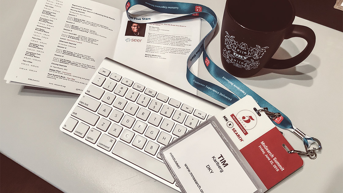 Badge and brochure for 2018 MnSearch Summit