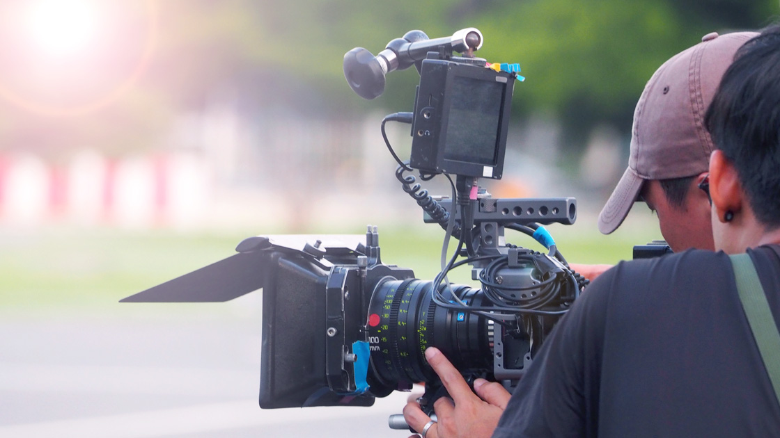 Behind the scenes look at videographers shooting film