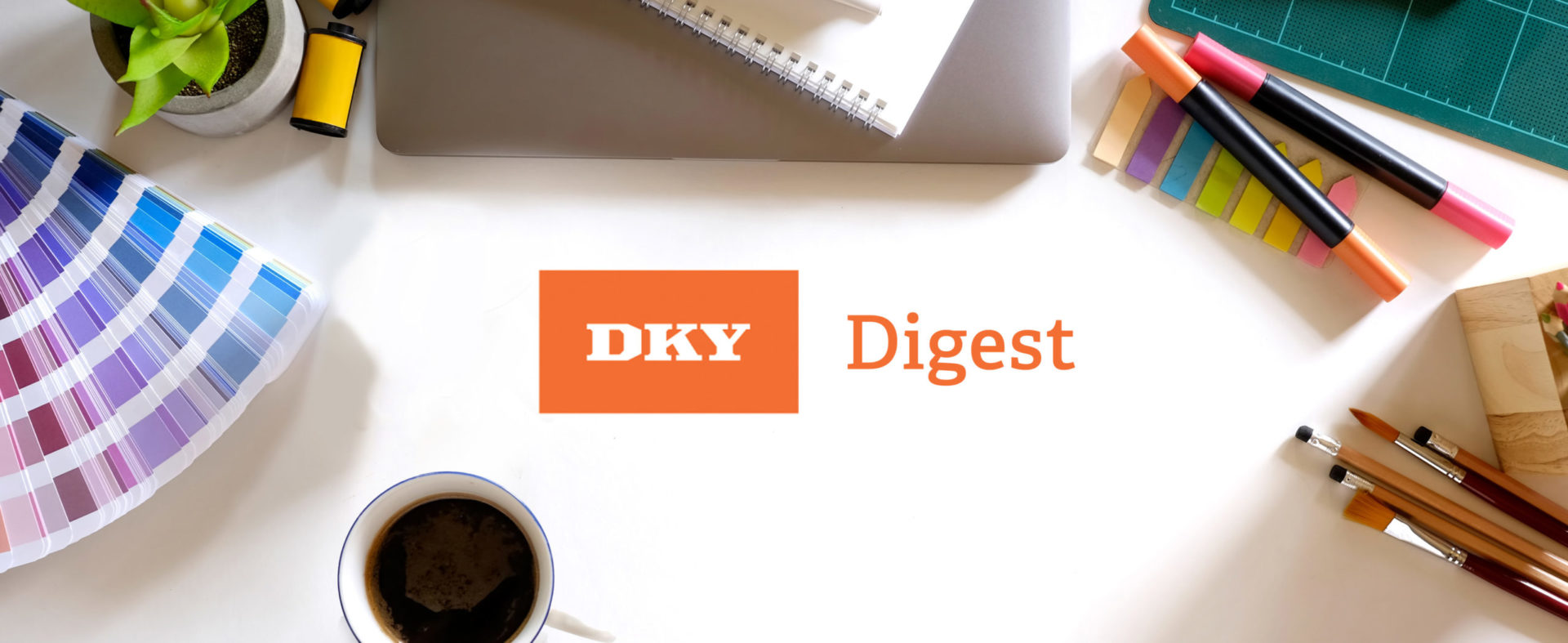 DKY digest text on desk surface