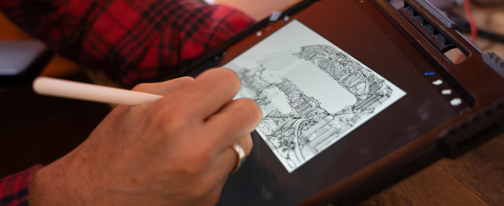 man sketching the winnebago erv2 graphics on an ipad