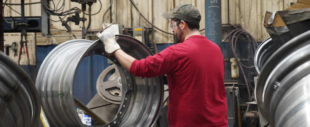 man working on wheel manufacturing