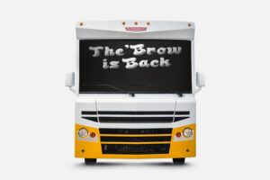 Front view of the Winnebago Brave with the words "the 'brow is back" on the windshield