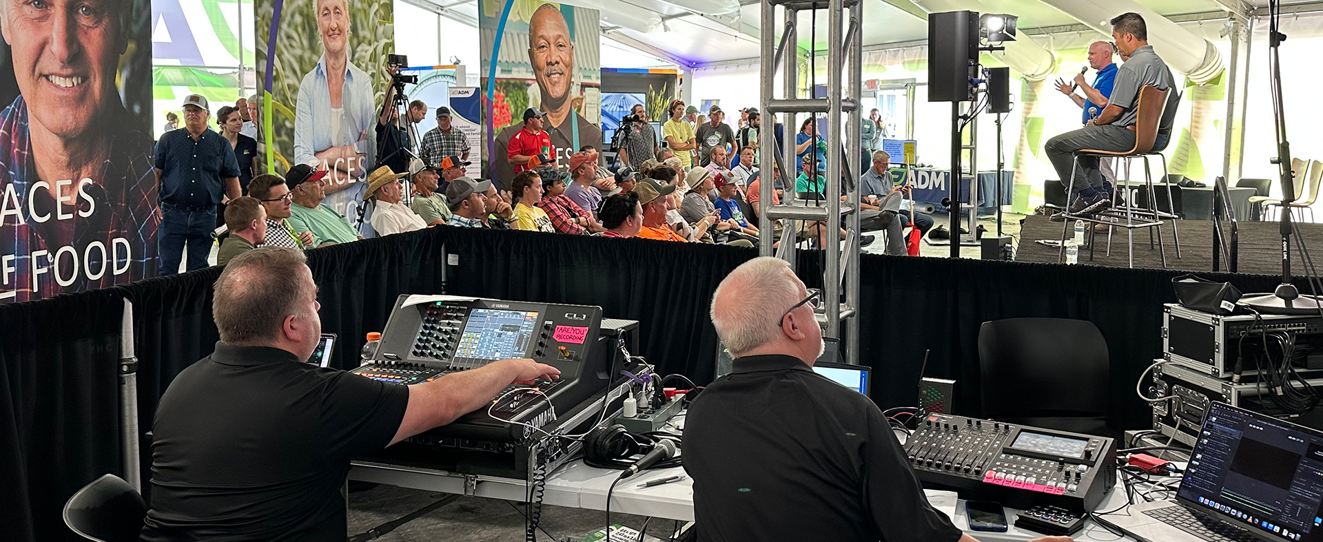 people sitting at event booth