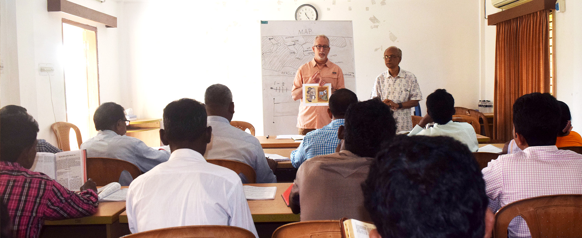 man teaching a class