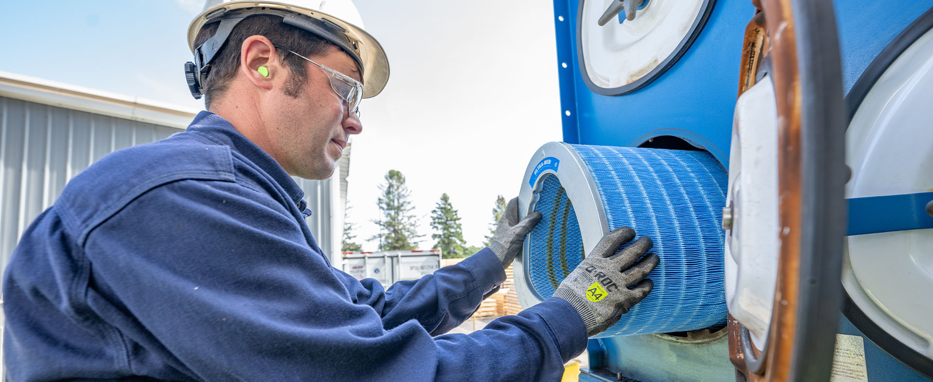 Man installing a Donaldson filter